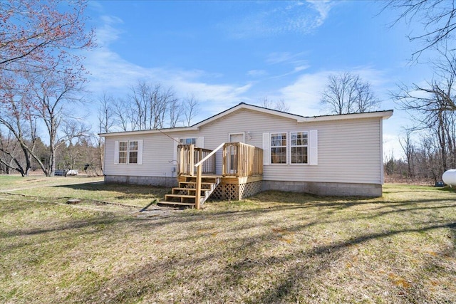 view of front of house with a front yard and a deck