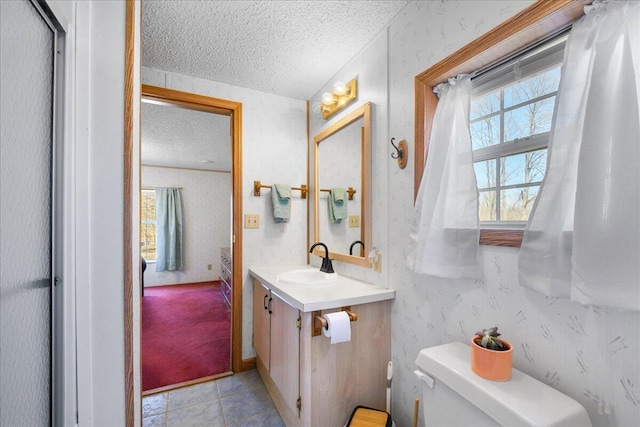 4638 W Mena Creek Xing, White Cloud, MI 49349 - bathroom with a textured ceiling, vanity, and tile patterned floors