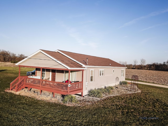 back of property with a lawn