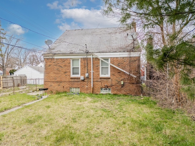 14424 Edmore Dr, Detroit, MI 48205 - back of property with fence, brick siding, and a yard