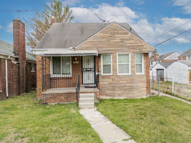 14424 Edmore Dr, Detroit, MI 48205 - bungalow-style home with a front lawn, fence, a porch, and stone siding