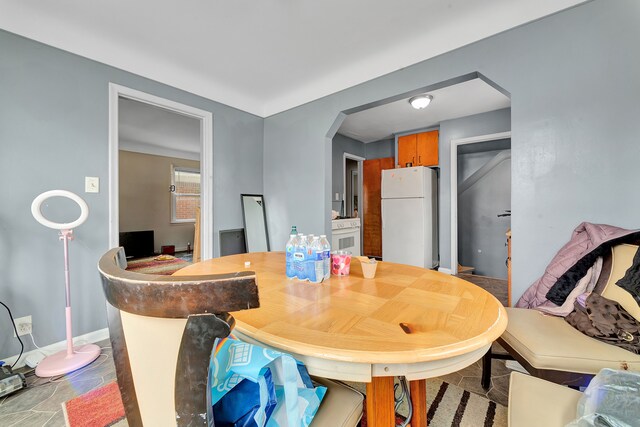 14424 Edmore Dr, Detroit, MI 48205 - dining area with baseboards and arched walkways