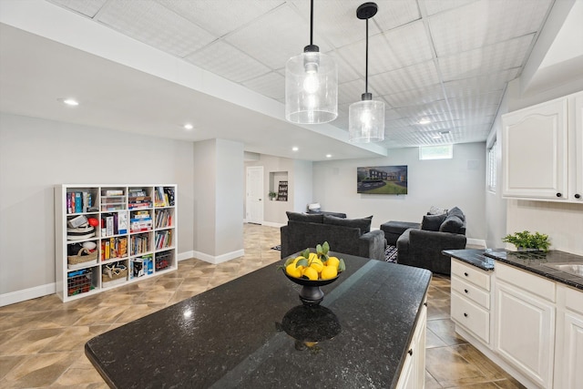 dining room with baseboards and recessed lighting