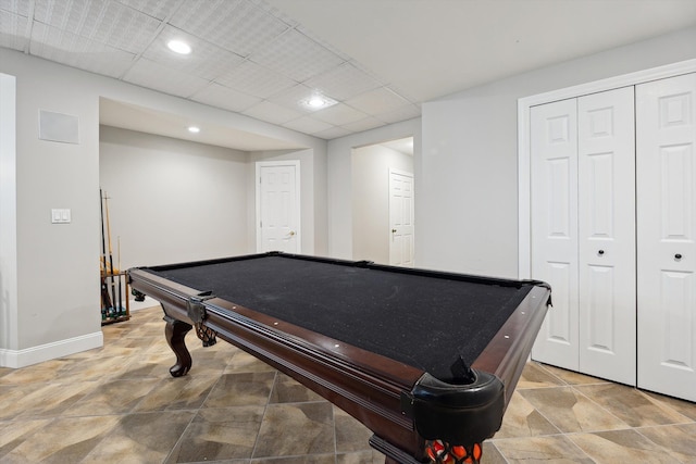 playroom featuring baseboards, billiards, stone finish flooring, and a paneled ceiling