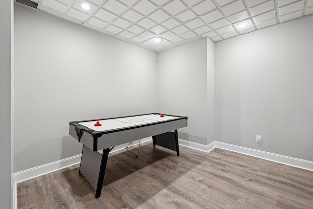playroom with baseboards, recessed lighting, and wood finished floors