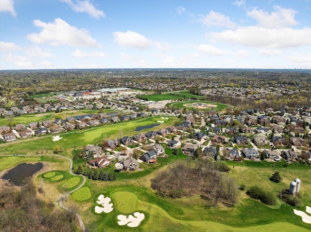 birds eye view of property with golf course view and a residential view