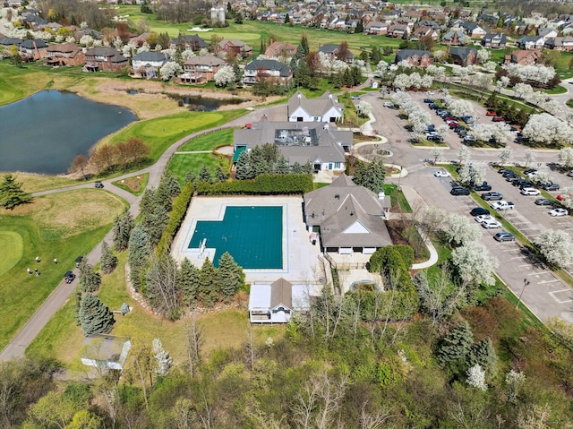 birds eye view of property featuring a water view and a residential view