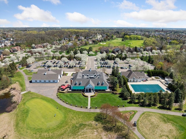 bird's eye view featuring golf course view and a residential view