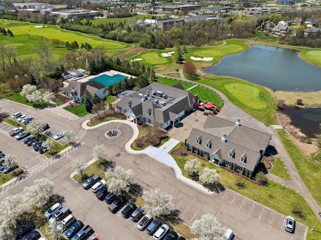 aerial view featuring a water view and view of golf course