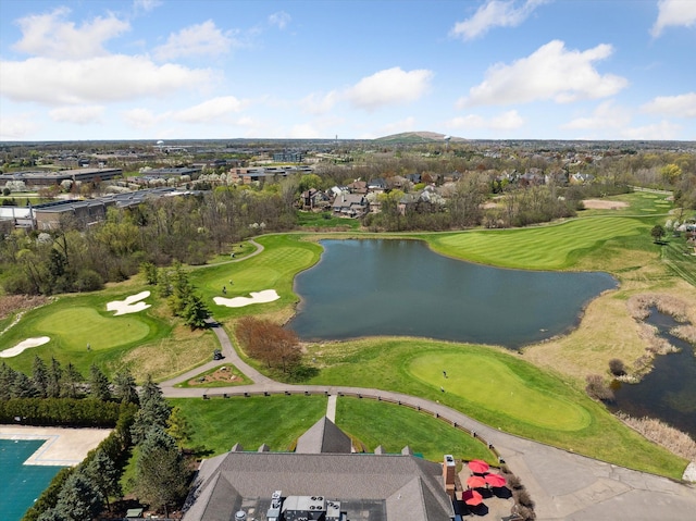 bird's eye view with a water view, view of golf course, and a residential view