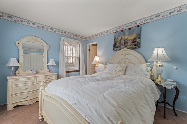 bedroom featuring baseboards and carpet flooring