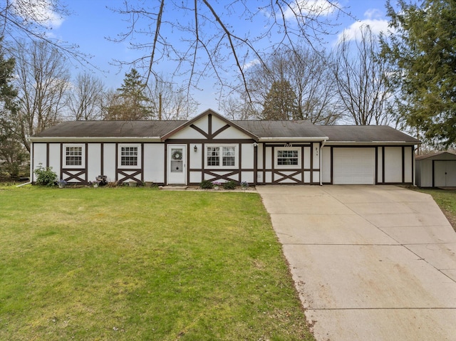 view of front of house featuring stucco siding, driveway, a front yard, and a garage
