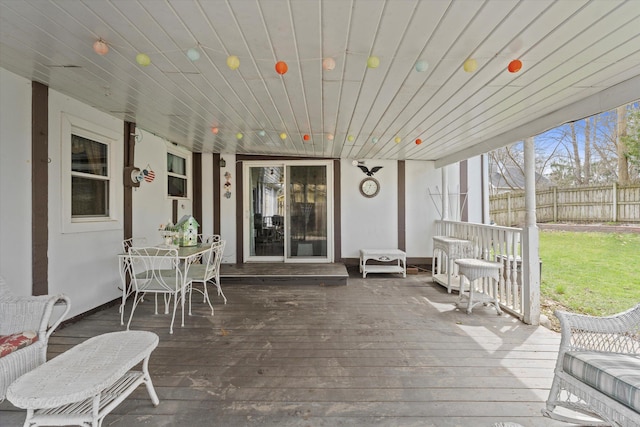 deck featuring fence and outdoor dining space