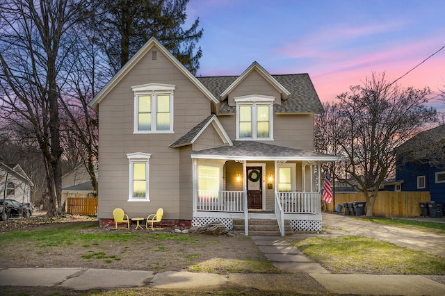 265 Bailey Ave, South Haven, MI 49090 - view of front of property with a porch, fence, and a shingled roof