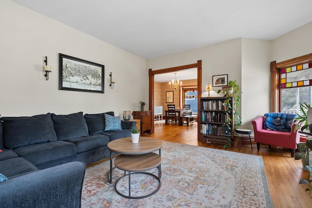265 Bailey Ave, South Haven, MI 49090 - living area featuring hardwood / wood-style floors, a wealth of natural light, and a notable chandelier
