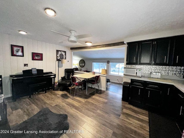 17669 Lake Dr, Barryton, MI 49305 - dining room with ceiling fan, wood finished floors, and a textured ceiling