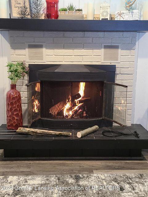 17669 Lake Dr, Barryton, MI 49305 - detailed view of a warm lit fireplace