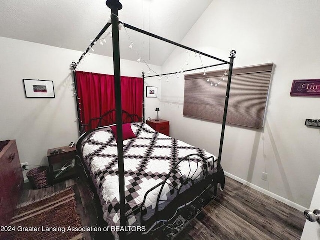 17669 Lake Dr, Barryton, MI 49305 - bedroom with wood finished floors, baseboards, and lofted ceiling