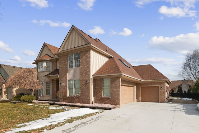 traditional home with driveway, brick siding, roof with shingles, and a garage