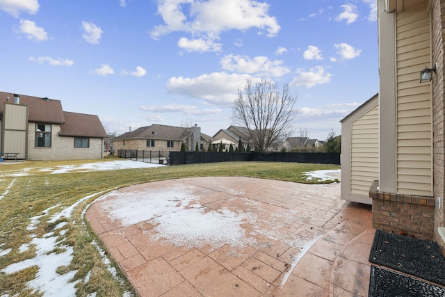 view of patio / terrace featuring fence and a residential view