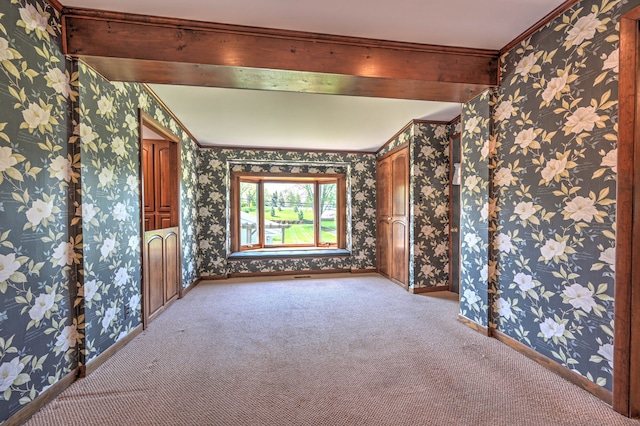 390 Red Oak Ln, Rochester Hills, MI 48307 - spare room with carpet, wallpapered walls, beamed ceiling, baseboards, and ornamental molding