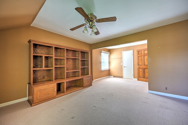 390 Red Oak Ln, Rochester Hills, MI 48307 - unfurnished living room featuring baseboards, a ceiling fan, carpet, and lofted ceiling