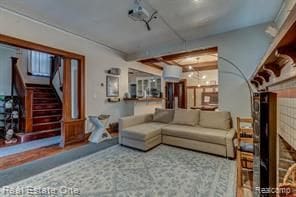 living area featuring stairway