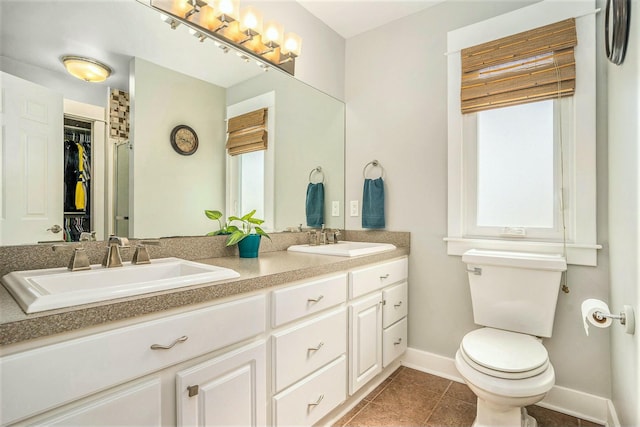 1332 Fluorite Ave, Zeeland, MI 49464 - full bath with tile patterned flooring, baseboards, a sink, and toilet