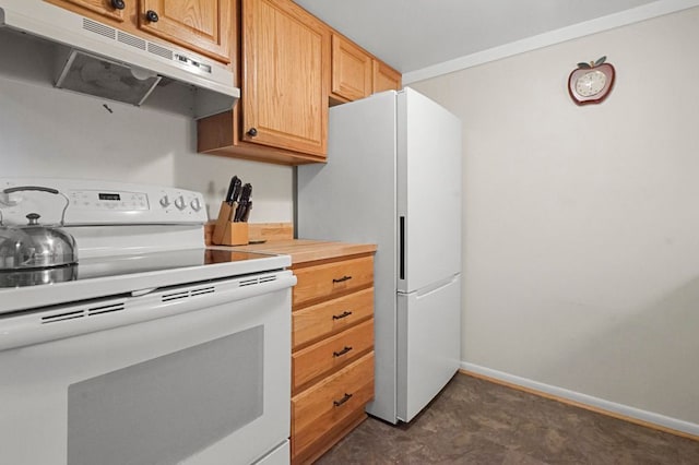 kitchen featuring white appliances, under cabinet range hood, baseboards, and light countertops