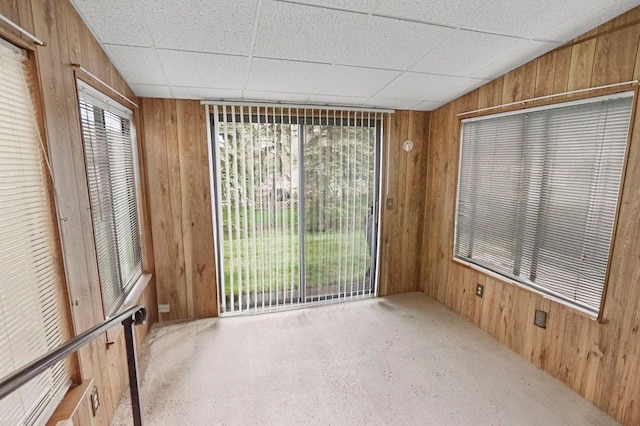 spare room with wooden walls
