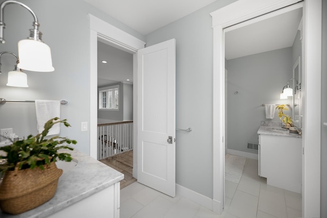 46815 Elizabeth Ln, Decatur, MI 49045 - hall featuring an upstairs landing, a sink, and baseboards