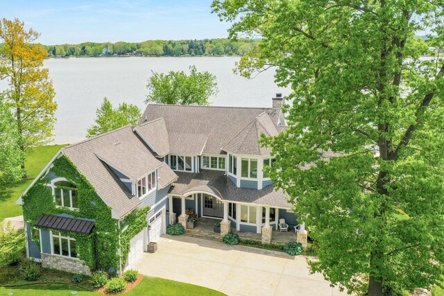 46815 Elizabeth Ln, Decatur, MI 49045 - shingle-style home with driveway, an attached garage, a porch, and a water view