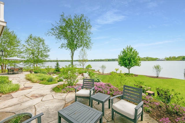 46815 Elizabeth Ln, Decatur, MI 49045 - view of patio featuring a water view and outdoor dining space