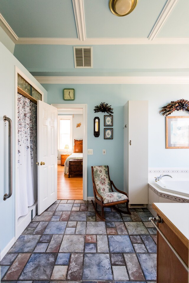 full bathroom with ornamental molding, stone tile floors, a shower with curtain, baseboards, and a bath