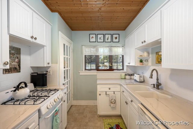 kitchen featuring a sink, white appliances, wood ceiling, decorative backsplash, and white cabinetry