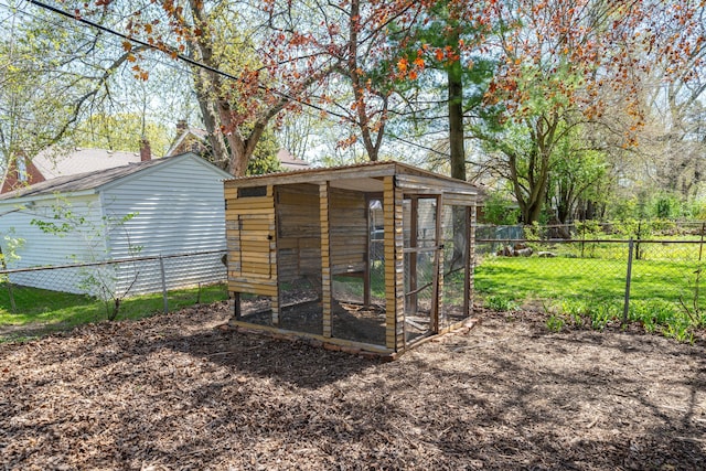 view of poultry coop featuring fence