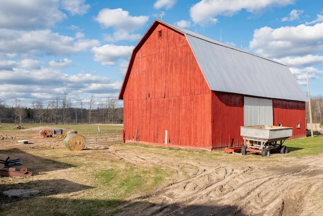 view of barn with a rural view