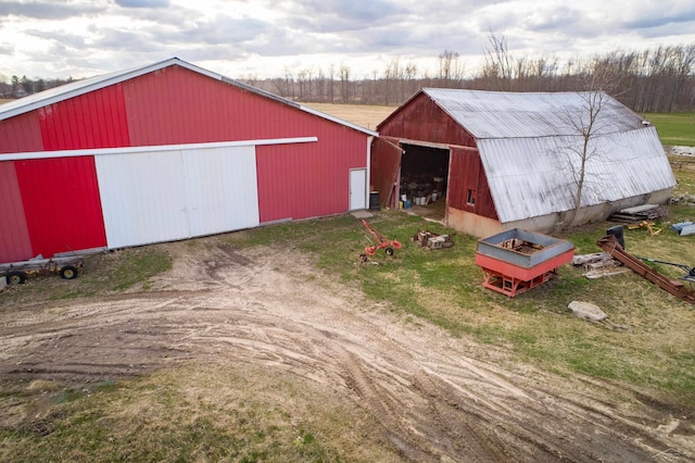 view of pole building featuring driveway