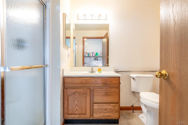 full bath featuring vanity, toilet, and a stall shower