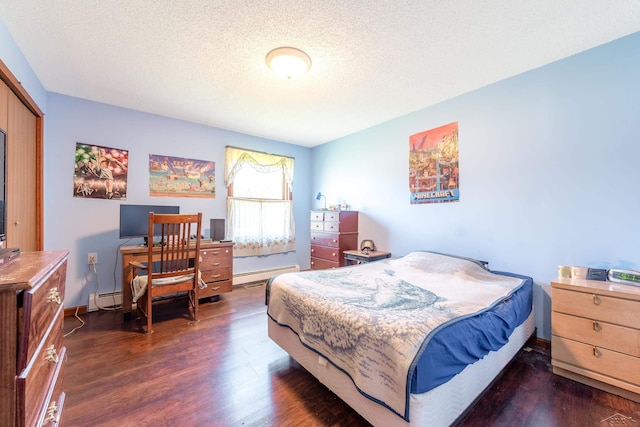 bedroom featuring a baseboard radiator, wood finished floors, and a textured ceiling