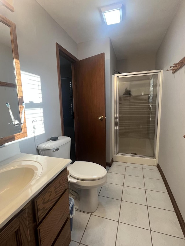 303 Sydelle Ave, Kalamazoo, MI 49006 - bathroom with vanity, tile patterned floors, and a stall shower