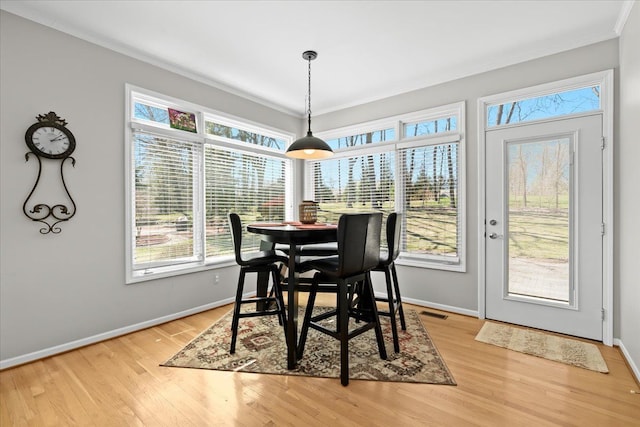 4435 Driftwood Dr, Commerce Twp, MI 48382 - dining room with crown molding and light wood-type flooring