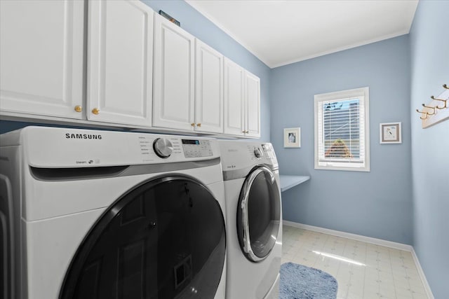 4435 Driftwood Dr, Commerce Twp, MI 48382 - washroom with washer and clothes dryer, cabinet space, and crown molding