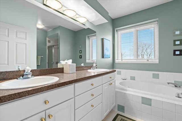 4435 Driftwood Dr, Commerce Twp, MI 48382 - full bathroom featuring a shower stall, double vanity, a garden tub, and tile patterned floors