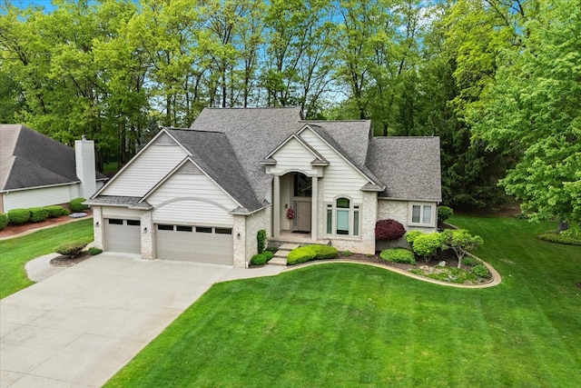 4435 Driftwood Dr, Commerce Twp, MI 48382 - traditional-style home featuring driveway, an attached garage, a front lawn, and roof with shingles
