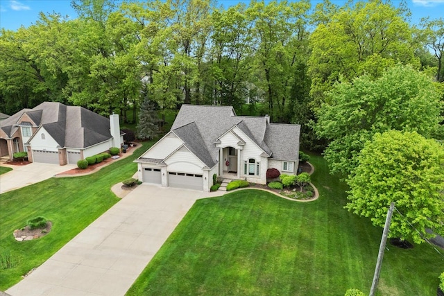 4435 Driftwood Dr, Commerce Twp, MI 48382 - view of front facade with driveway, a garage, and a front yard