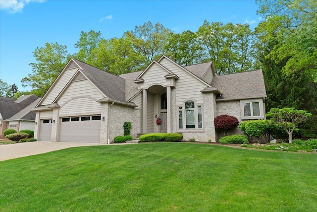 4435 Driftwood Dr, Commerce Twp, MI 48382 - view of front facade featuring a front yard, driveway, an attached garage, roof with shingles, and brick siding