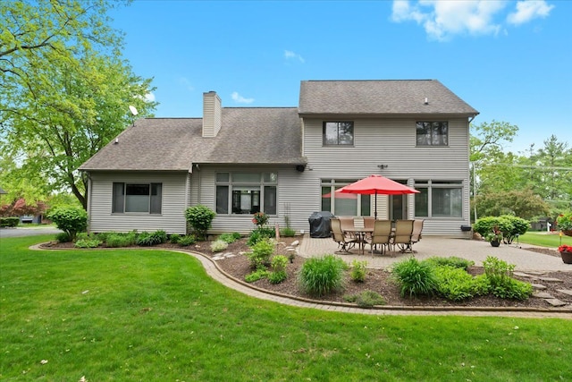 4435 Driftwood Dr, Commerce Twp, MI 48382 - back of property with a chimney, a patio area, and a yard