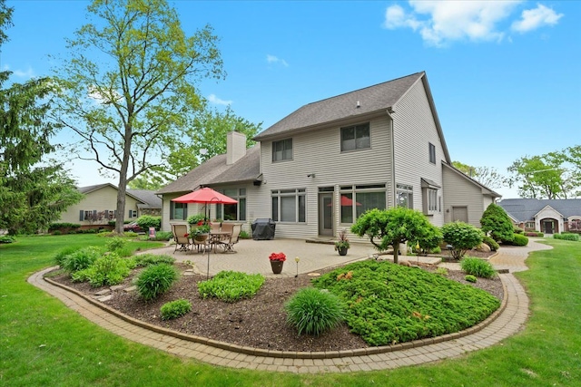 4435 Driftwood Dr, Commerce Twp, MI 48382 - back of house featuring a patio area, a lawn, and a chimney