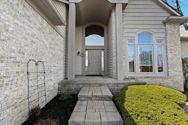 4435 Driftwood Dr, Commerce Twp, MI 48382 - property entrance featuring brick siding
